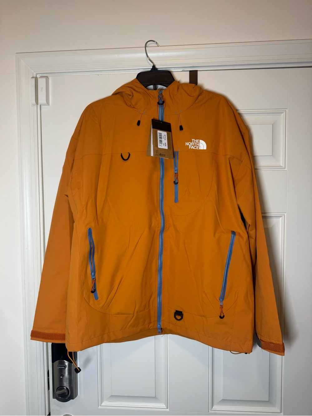 Yellow Hooded Jacket with Blue Zippers. No Brand.